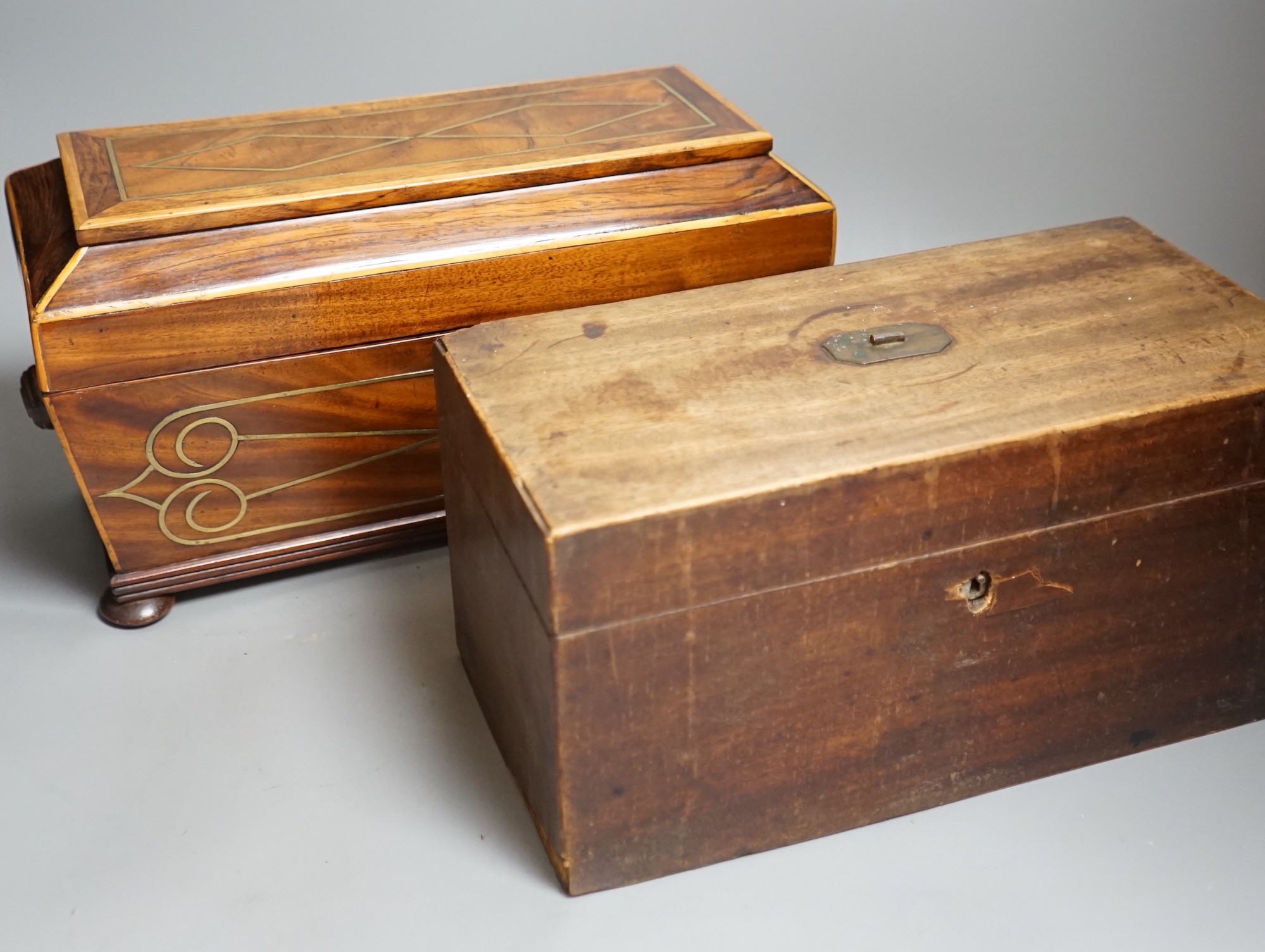 A Regency brass inlaid sarcophagus tea caddy and a George III mahogany caddy, sarcophagus caddy, 18.5cms high